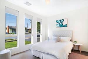 A photo of a Hot Property Group unit master bedroom to promote their house extension and construction business.